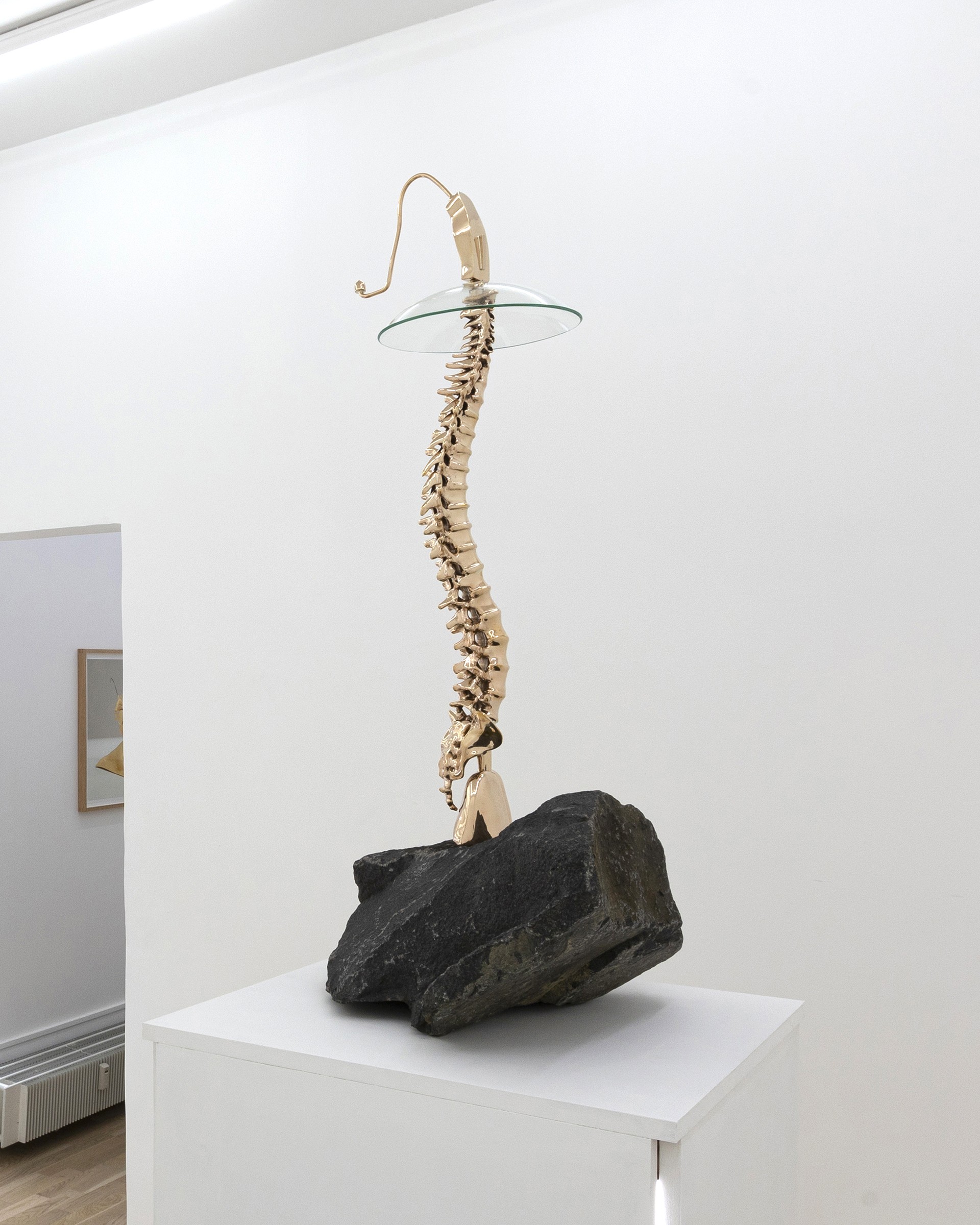 *Heavy Render_2*, 2023, polished bronze, granite, glass and rubber, 105 x 45 x 42 cm. Courtesy the artist & Spiaggia Libera, Paris.