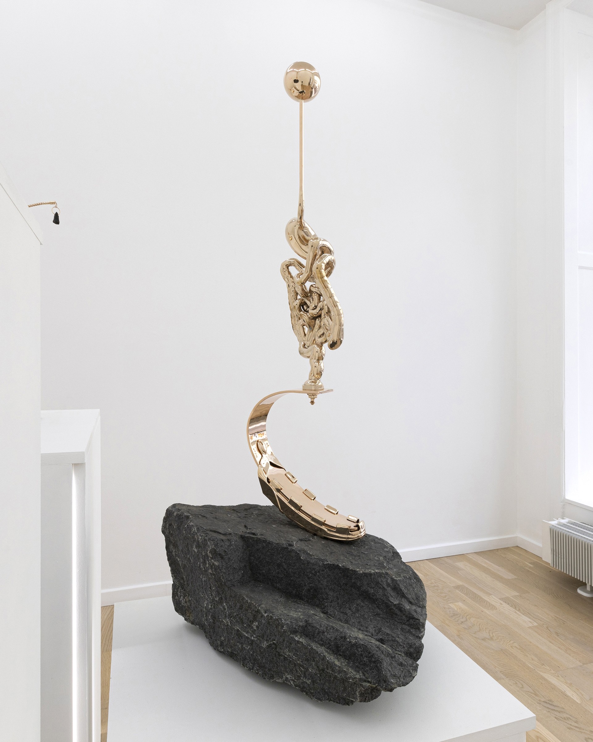 *Heavy Render_3*, 2023, polished bronze and granite, 104 x 45 x 54 cm. Courtesy the artist & Spiaggia Libera, Paris.